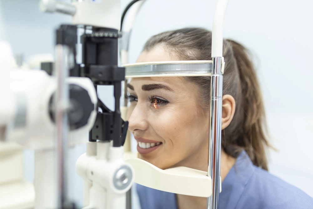 Eye doctor examining a female patient for eye health